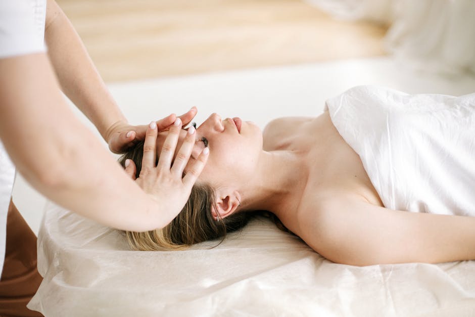 Woman receiving a soothing facial massage at a luxurious spa, enhancing relaxation and wellness
